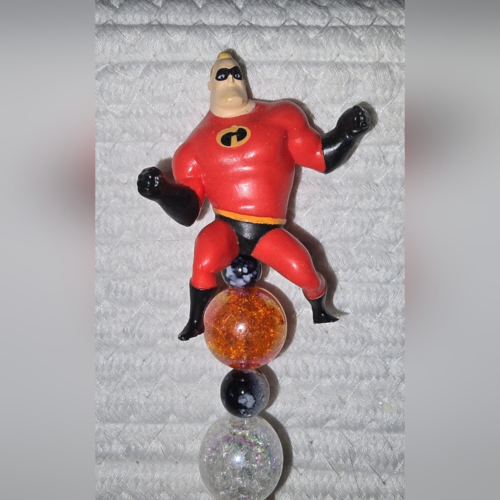 Red and Black Superhero Figurine Ink Pen